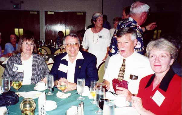 Roxanne H. & hubby Vince and Jim B. and wife Joan. Mary B. is in the background.